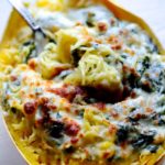 Spinach stuffed spaghetti squash topped with creamy garlic sauce and melted mozzarella cheese.